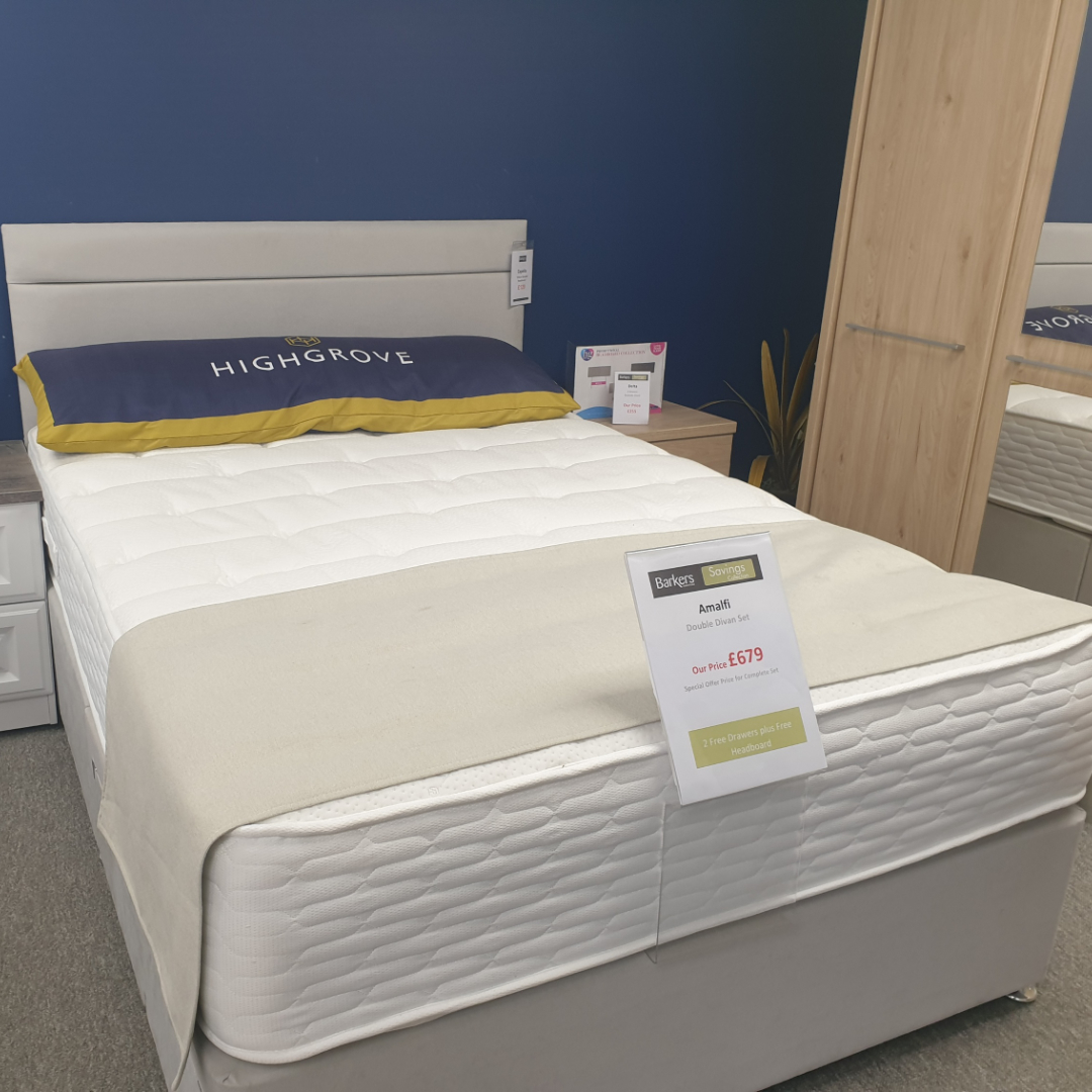 An Amalfi double bed with a grey fabric base and headboard